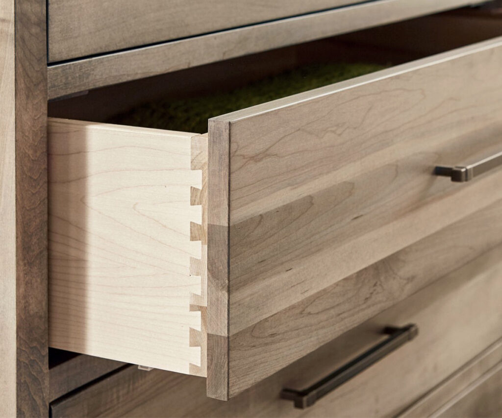 Dovetail drawer joinery on solid-wood dresser, showcasing Amish craftsmanship and durability.